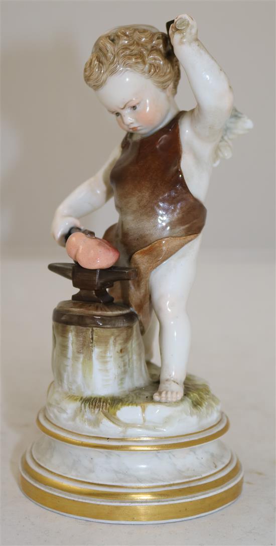 A Meissen porcelain figure of cupid depicted as a blacksmith forging a heart, 18.5cm